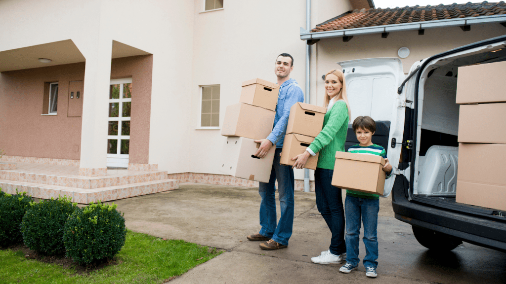 family-moving-holding-boxes