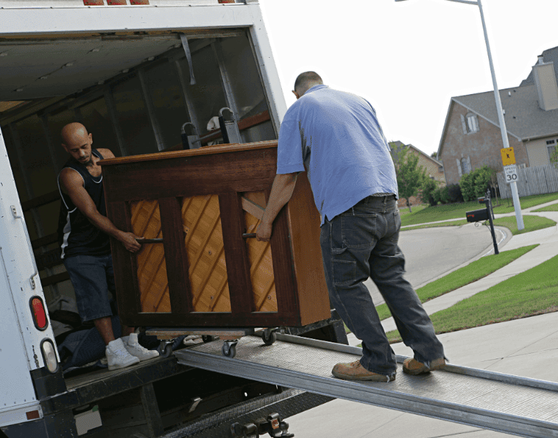 movers transporting a piano for a long-distance move.